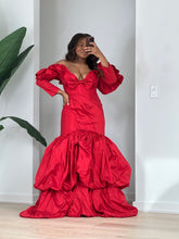 Load image into Gallery viewer, Three-quarter view of the red off-the-shoulder gown and voluminous two-tier balloon hem.
