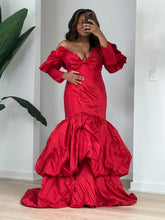 Load image into Gallery viewer, Full-length pose in the red taffeta gown with dramatic sleeves and layered balloon hem.