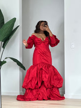 Load image into Gallery viewer, Front view highlighting the off-the-shoulder neckline and floor-length red balloon mermaid skirt.
